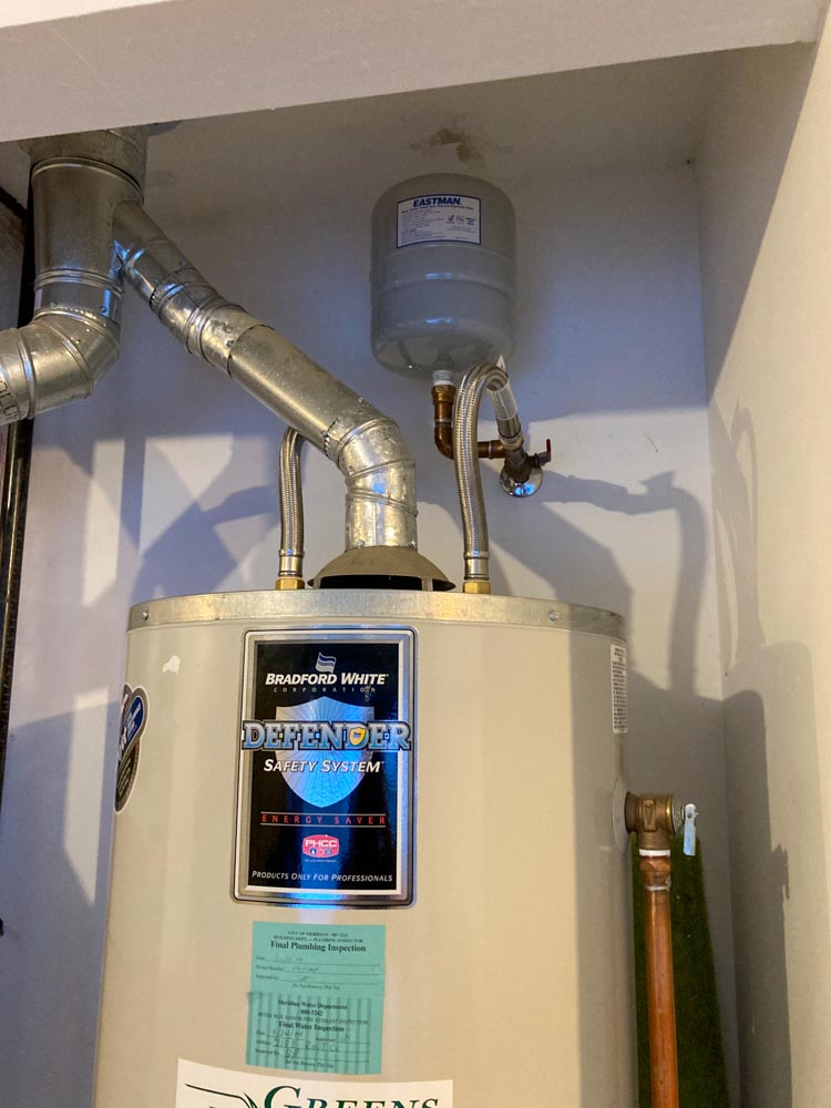 A water heater tank with properly installed ductwork