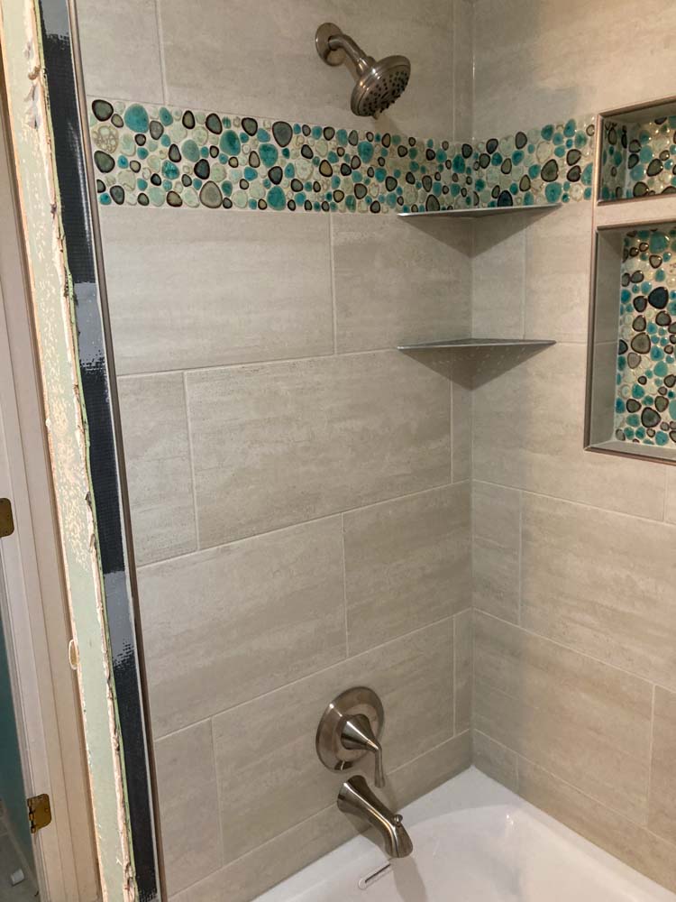 Plumbing issues, occupation in sanitation and handyman contractor concept with plumber repairing drain with plumbers snake (steel spiral that twists through pipes to collect dirt) in residential sink